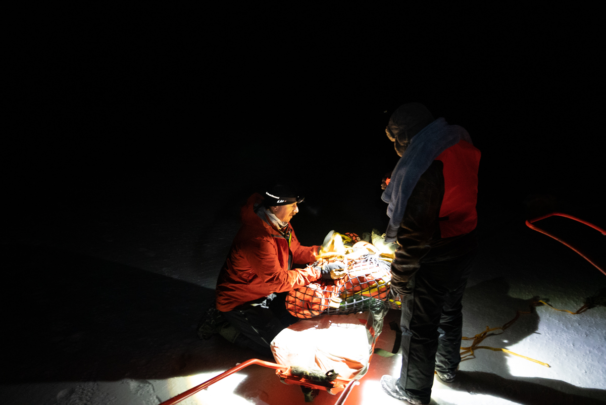 SAR Techs unpack sled